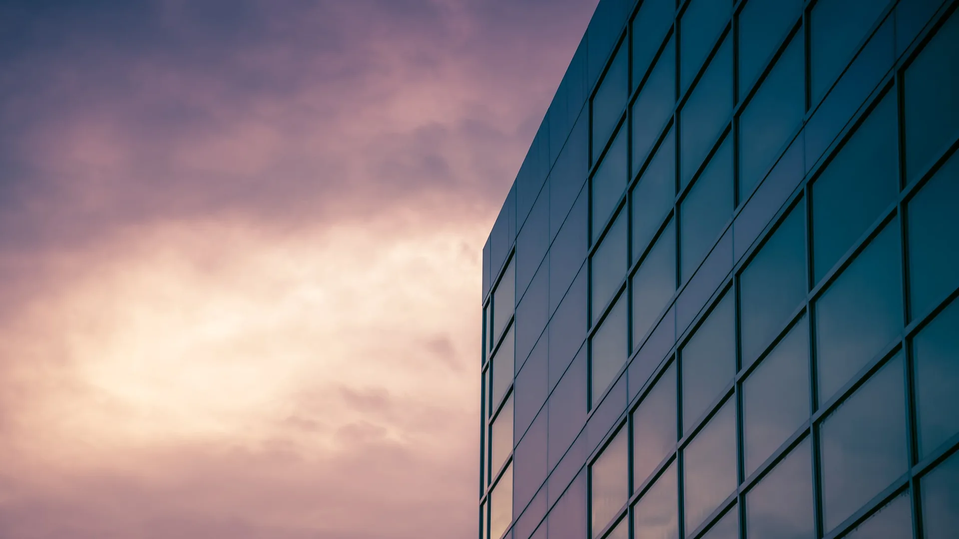 Glass office facade at dusk in the Phoenix valley